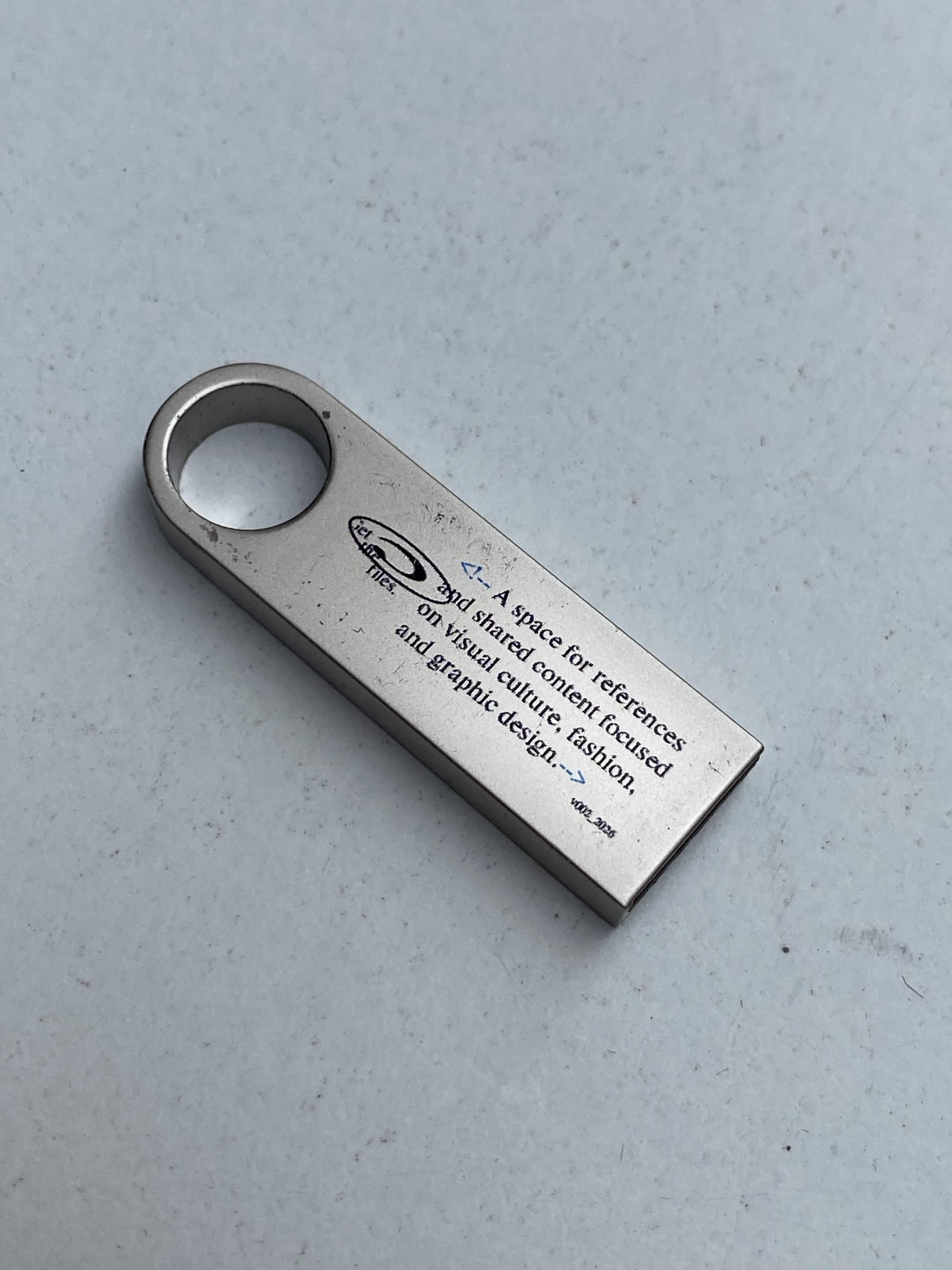 USB drive labeled 0000ff.website with white design